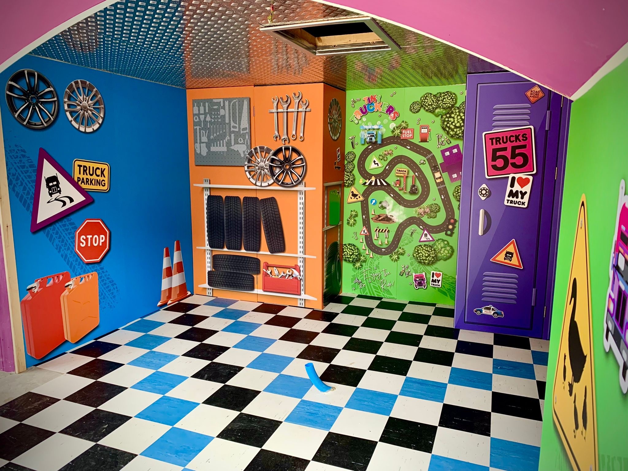 The Tiny Truckers attraction at Chessington World of Adventures with a blue, black and white chequerboard tile floor fitted by CWC Flooring