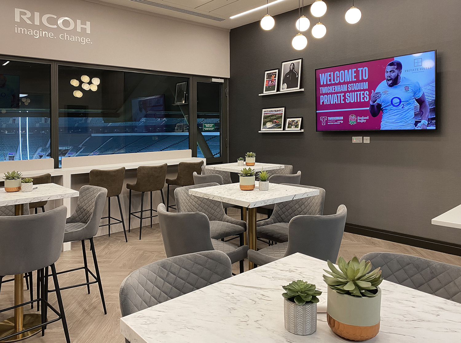 A private hospitality suite at Twickenham Stadium over a timber-effect plank floor, fitted by CWC Flooring
