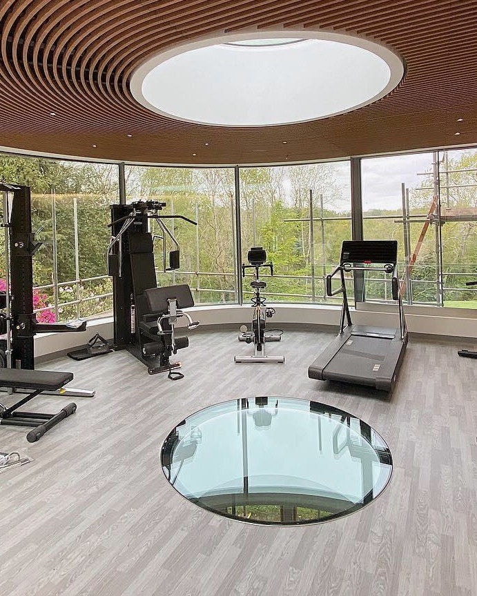 Resilient sports flooring running under gym equipment